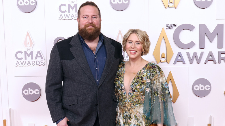 Erin Napier and Ben Napier smiling while posing together at an event