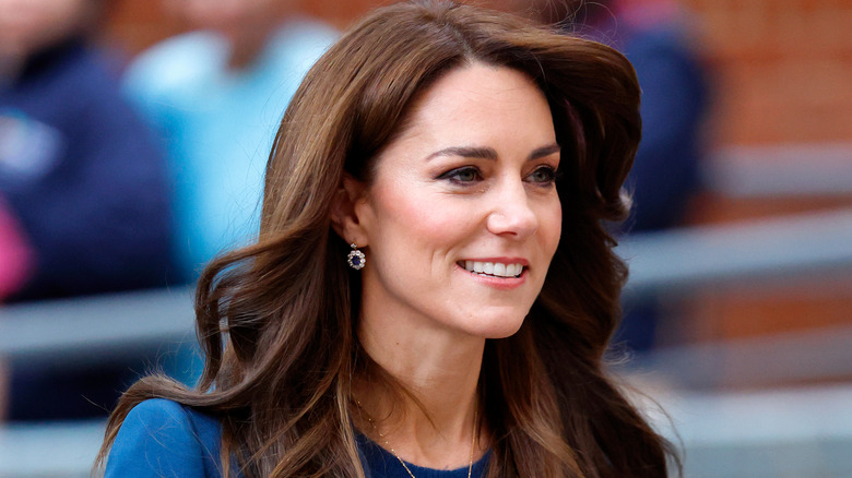 Kate Middleton smiling as she walks