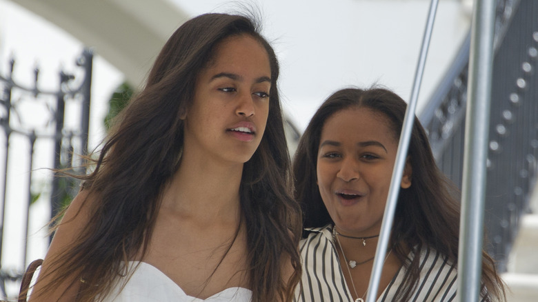 Closeup of Malia and Sasha Obama walking outside