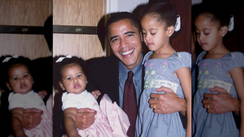 Barack Obama smiling with his two infant daughters
