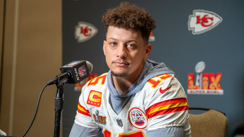 Patrick Mahomes looking dismayed while giving a press conference