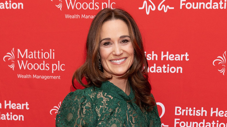 Pippa Middleton smiles on a London red carpet.