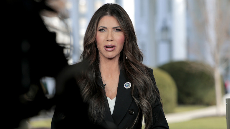 Kristi Noem speaks with Fox News outside the White House in March 2025