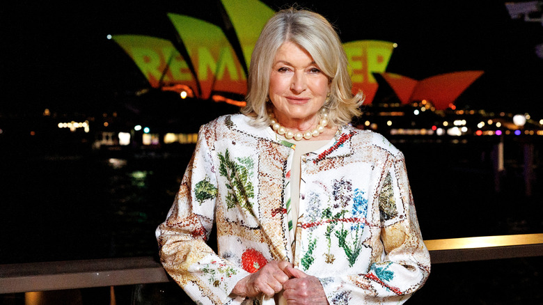 Martha Stewart posing for photos in a glitzy floral jacket