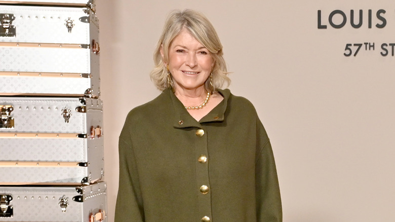 Martha Stewart smiling in a green blouse
