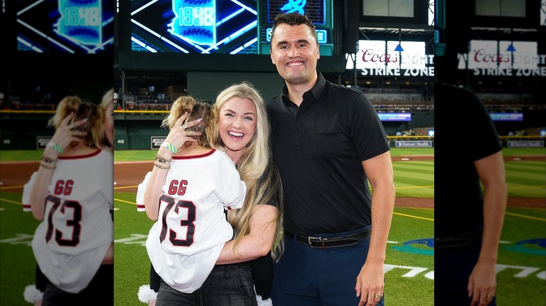Charlie and Erika Kirk with GG at baseball field