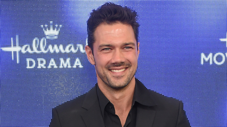 Ryan Paevey smiling at Hallmark event