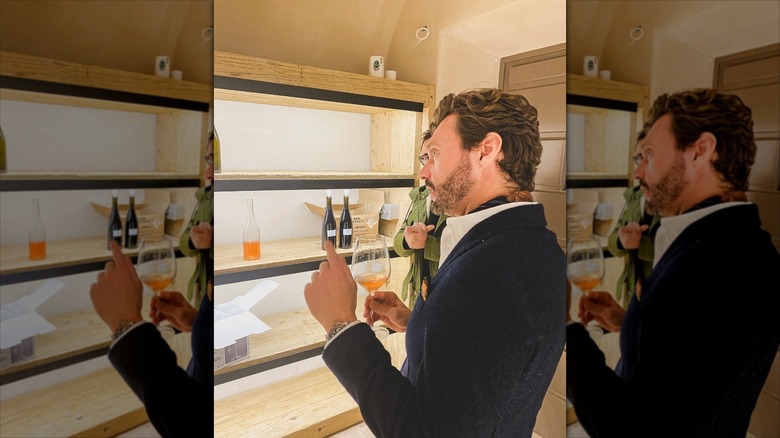 Ryan Seacrest drinking wine