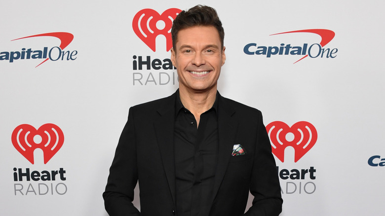 Ryan Seacrest smiling for photo at Jingle Ball
