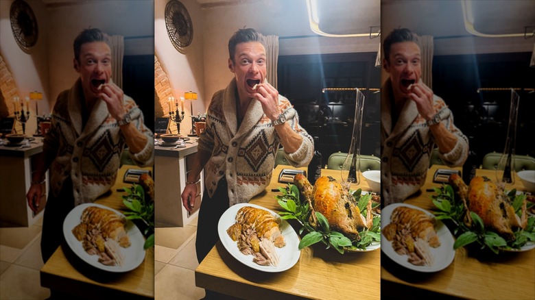 Ryan Seacrest eating bite of turkey at home