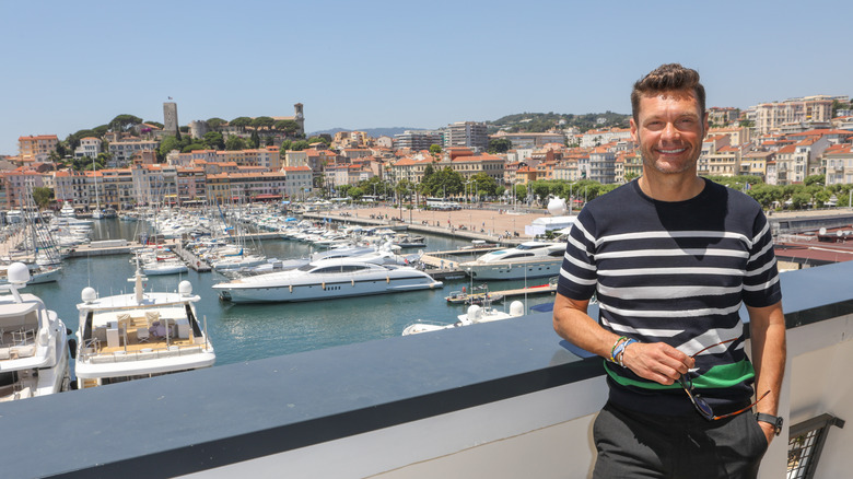 Ryan Seacrest smiling for a photo in Cannes, France