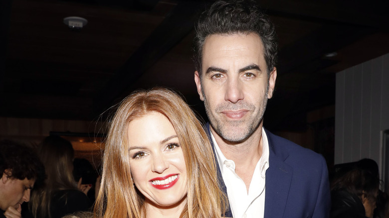 Sacha Baron Cohen and Isla Fisher snuggle up