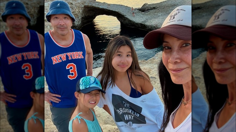Lisa with her husband and two daughters on vacation