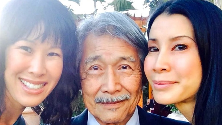 Lisa Ling takes a selfie with her father and sister