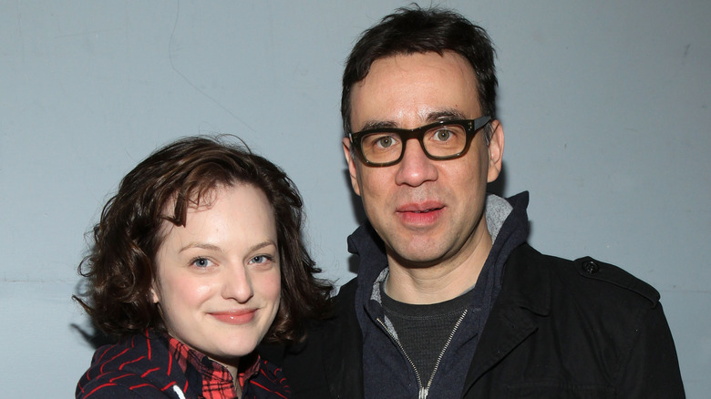 Fred Armisen and Elisabeth Moss posing for photos