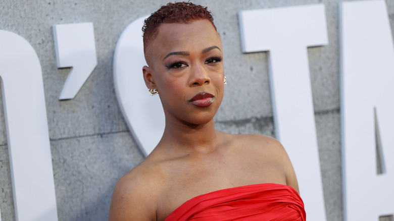 Samira Wiley posing for photos in a strapless red dress