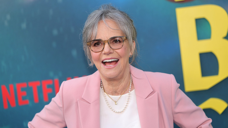 Sally Field smiling while posing on the red carpet for Remarkably Bright Creatures