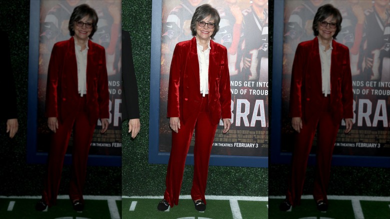 Sally Field wearing a red velvet pantsuit at the "80 for Brady" premiere