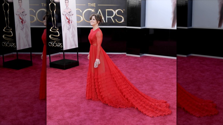 Sally Field wearing a long red dress with ruffles at 85th Academy Awards