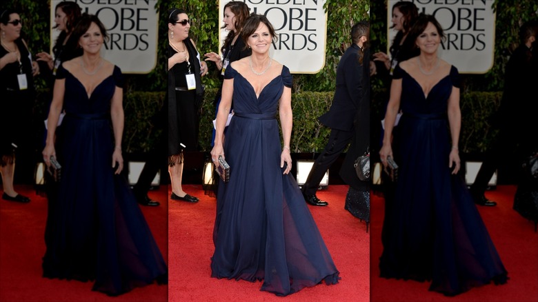 Sally Field smiling for a photo while wearing a navy blue dress at the 2013 Golden Globes