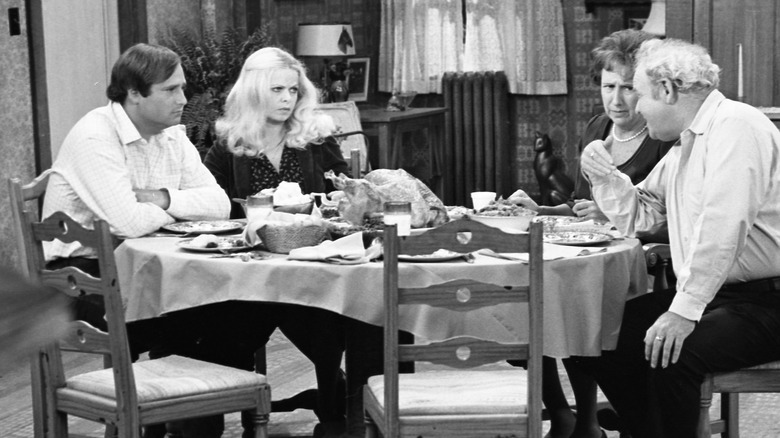 The cast of All in the Family sitting at the dinner table