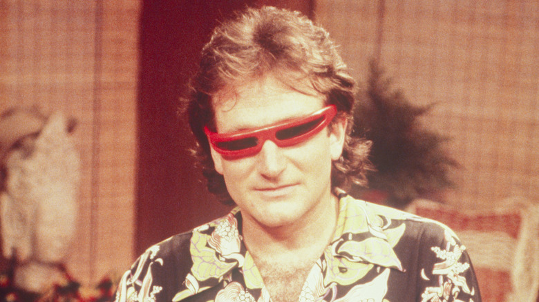 Robin Williams wearing strange red sunglasses