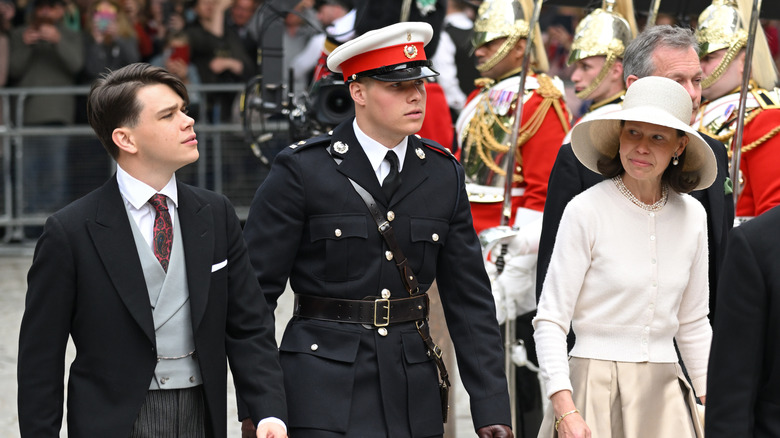 Samuel Chatto, Arthur Chatto, and Lady Sarah Chatto at formal royal event outside surrounded by guards