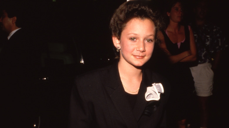 Sara Gilbert wearing a black outfit in 1989
