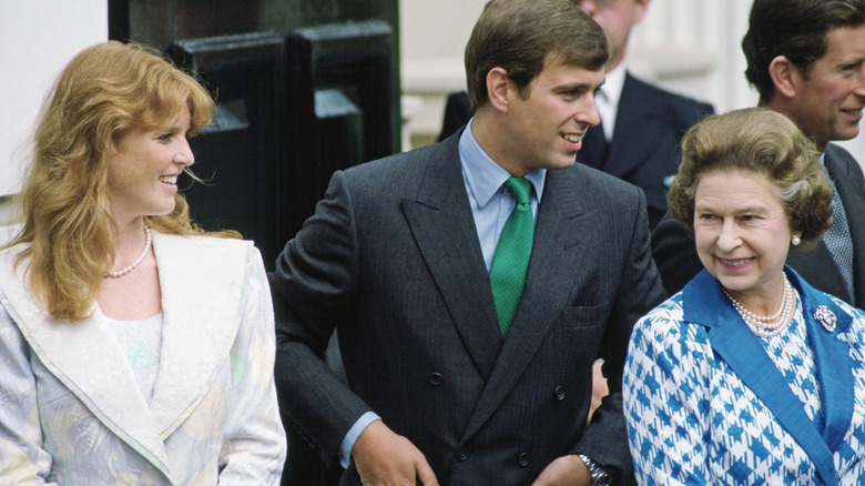 Sarah Ferguson, Prince Andrew, and Queen Elizabeth smiling