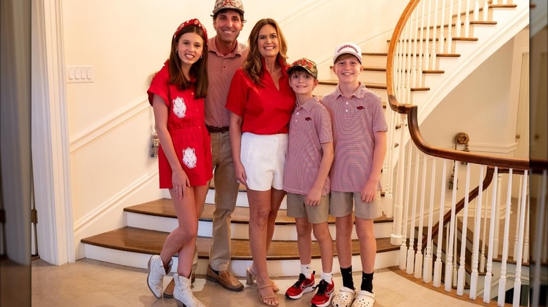Sarah Hickabee Sanders smiling with her husband and three children