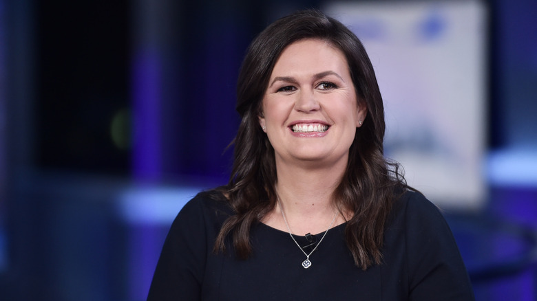 Sarah Huckabee Sanders smiles