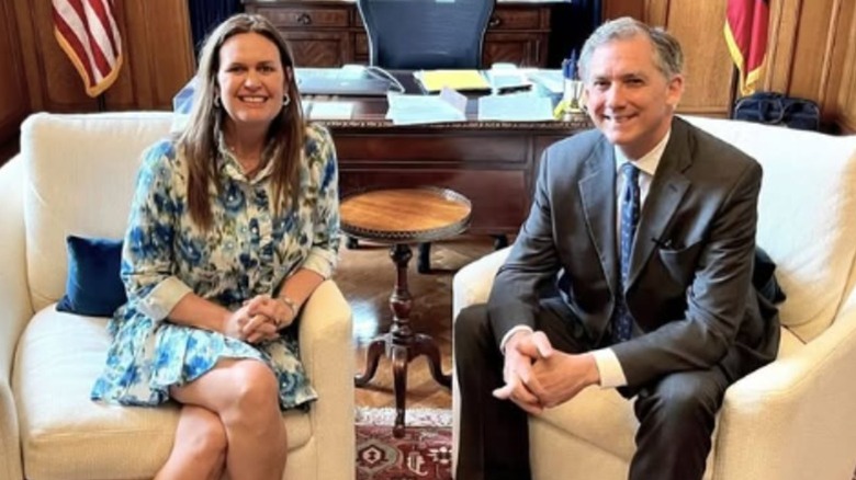Sarah Huckabee Sanders and French Hill smile together for a photo (2025)