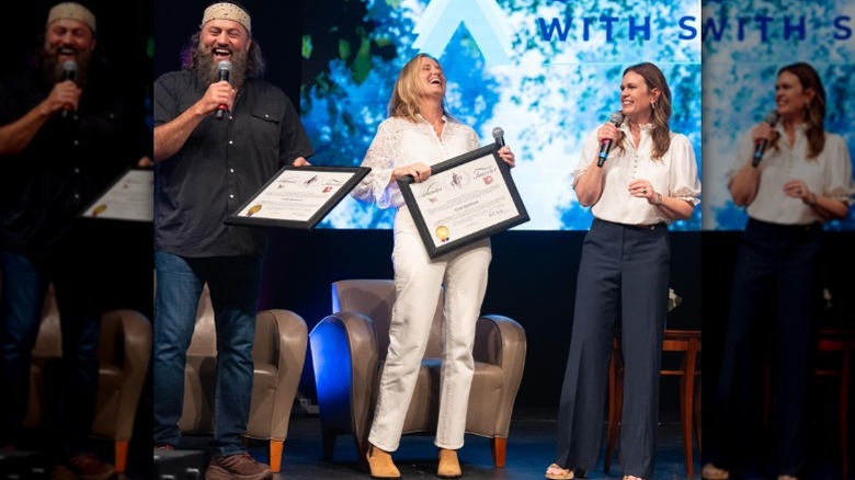 Willie Robertson, Korie Robertson, and Sarah Huckabee Sanders on stage together (2025)