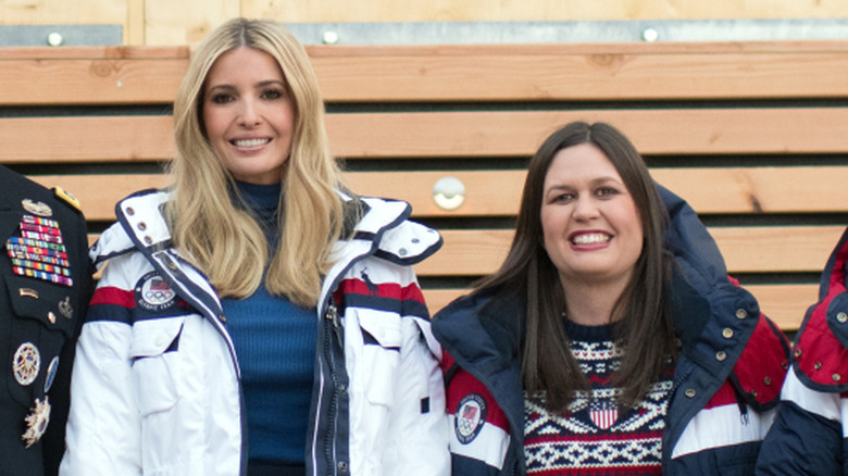 Close up of Ivanka Trump standing beside Sarah Huckabee Sanders