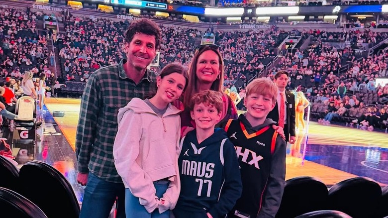 image of Sarah Huckabee Sanders and her family at a basketball game