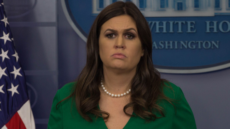 image of Sarah Huckabee Sanders with a confused look inside the White House