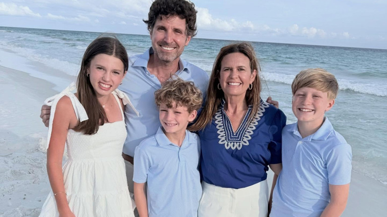 image of Sarah Huckabee Sanders and her family at a beach