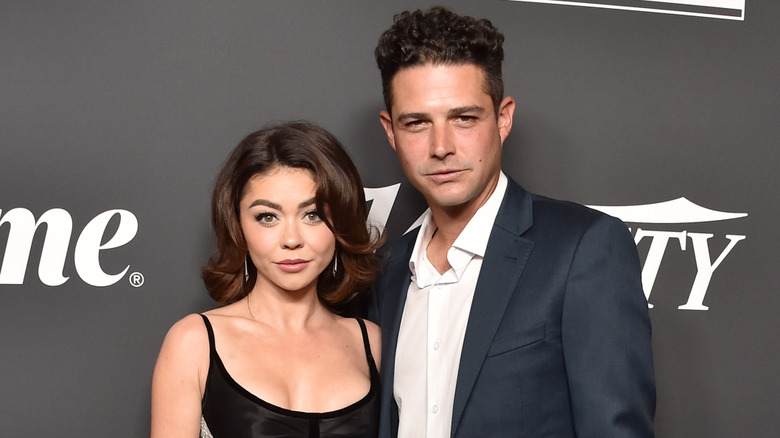 Sarah Hyland and Wells Adams posing for photos