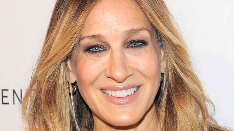 Sarah Jessica Parker smiles with straight hair