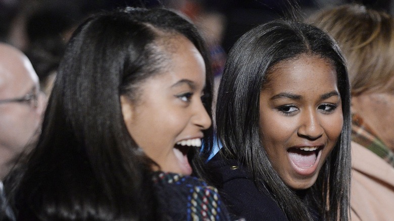 Malia and Sasha Obama laughing