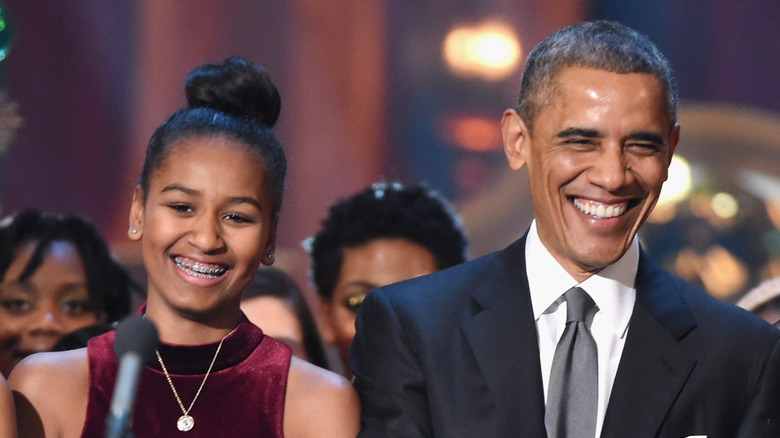 Sasha and Barack Obama smiling
