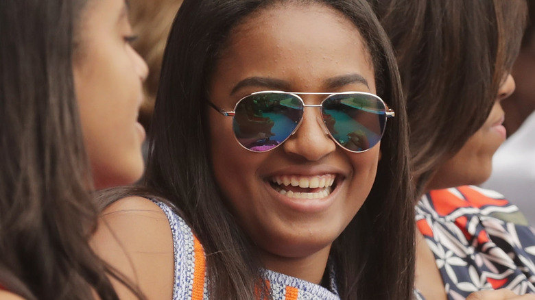 Sasha Obama smiling sunglasses