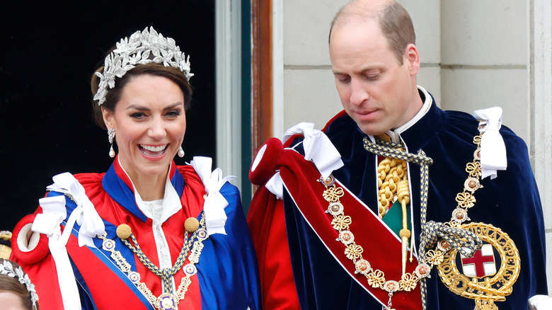 Prince William looking down and Princess Catherine smiling