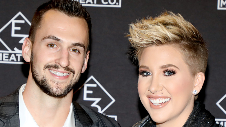 Savannah Chrisley and Nic Kerdiles pose on the red carpet together
