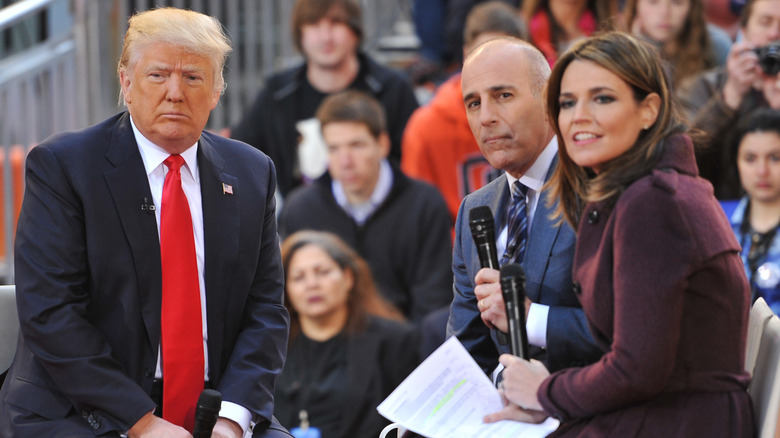 Donald Trump, Matt Lauer, Savannah Guthrie in front of a group of people