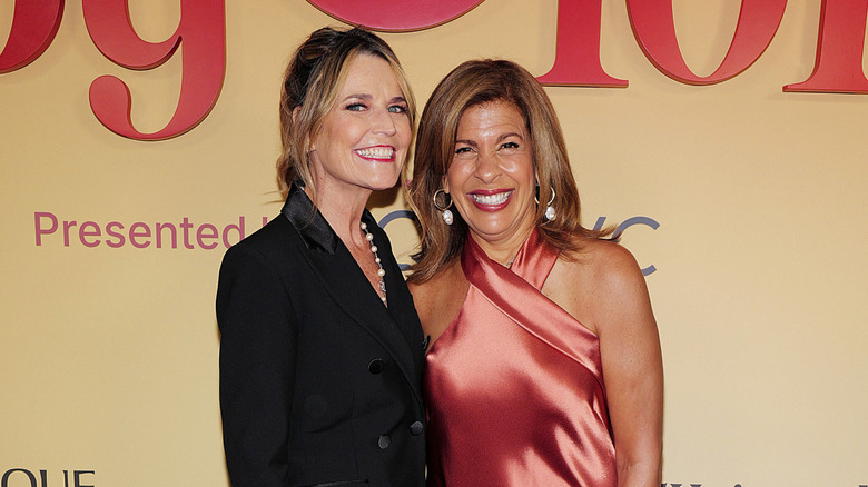 Savannah Guthrie and Hoda Kotb smiling on the red carpet