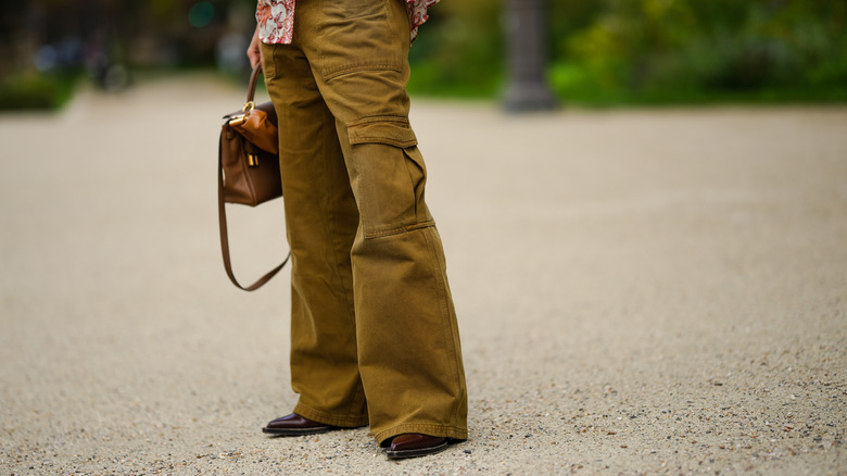 Woman in olive puddle pants