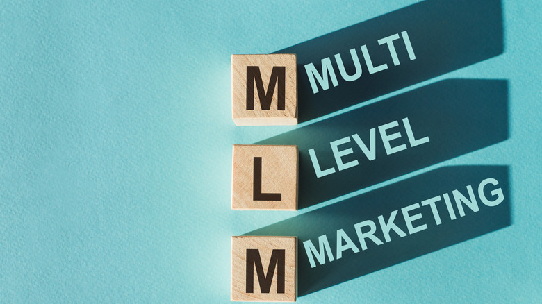 MLM spelled out in block tiles 