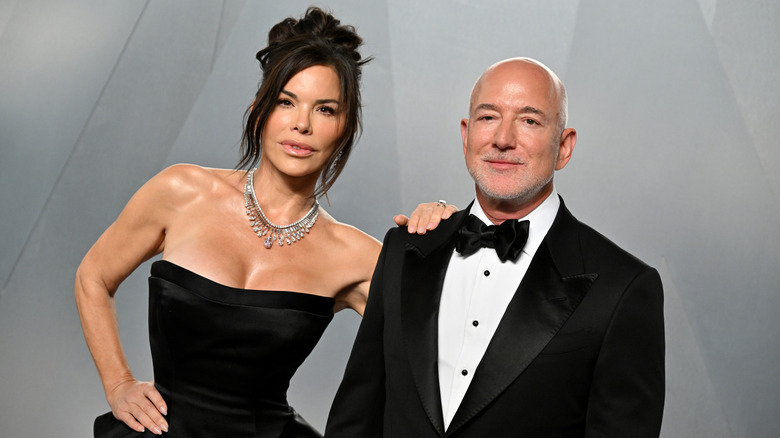 Lauren Sánchez Bezos and Jeff Bezos at an event with both wearing black