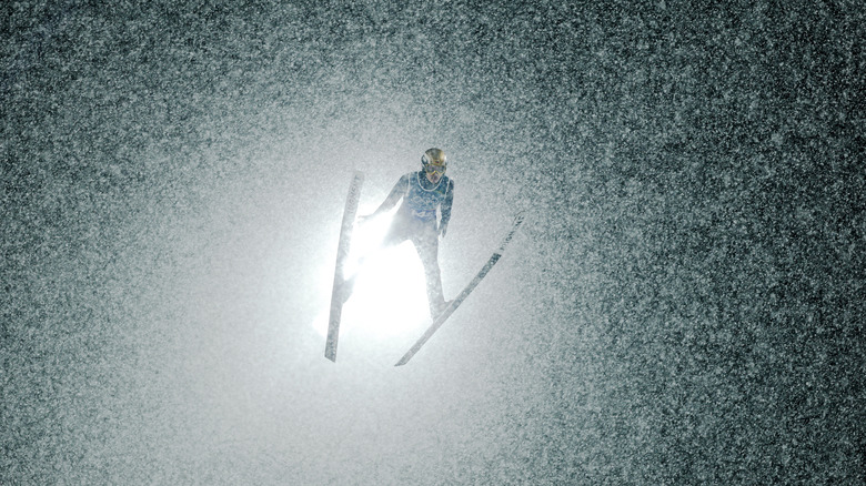 A ski jumper competing at the 2026 Olympics